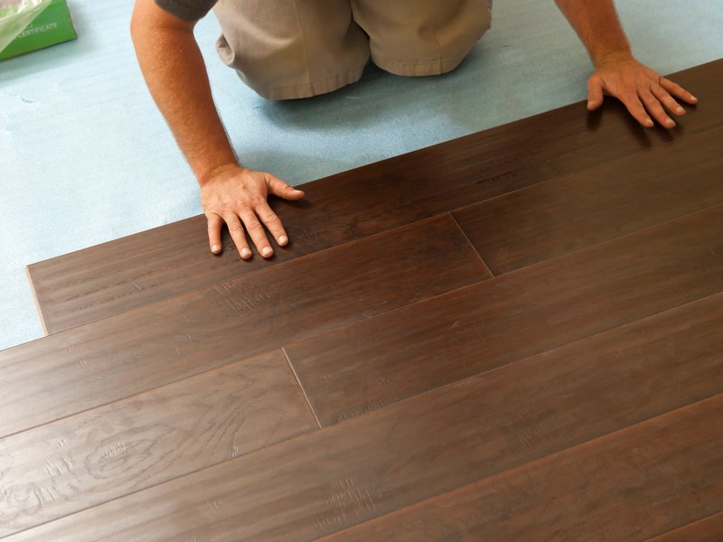 Person installing flooring - Professional flooring installation from Carpet & Flooring By Denny Lee in Abingdon, MD